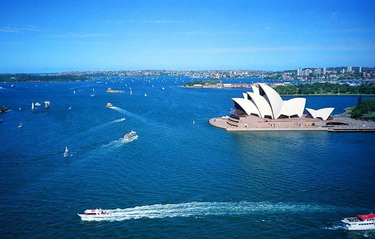Mention "Sydney, Australia" and most people think of the Opera House. Shaped like huge shells or billowing sails, this famous building on Sydney's Bennelong Point graces the list of UNESCO World Heritage Sites and is one of the world's great architectural icons. The location is stunning. Water surrounds the structure on three sides, and the Royal Botanic Gardens border it to the south.