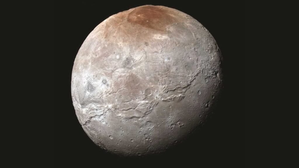 Scientists Unravel Mystery Behind Red Spot On Pluto’s Moon Charon